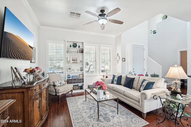 living room featuring ornamental molding, ceiling fan, and dark wood-type flooring