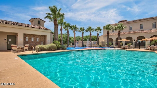 view of pool featuring a patio