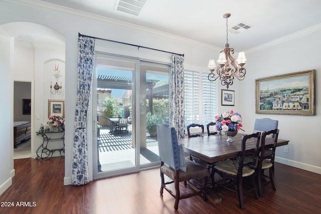 dining area with crown molding and dark wood-type flooring