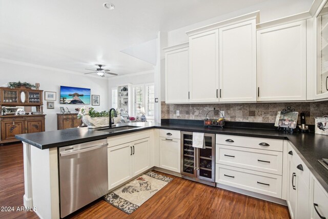 kitchen with wine cooler, dark hardwood / wood-style floors, sink, kitchen peninsula, and stainless steel dishwasher