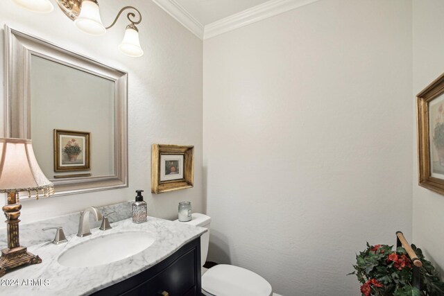 bathroom with crown molding, vanity, and toilet