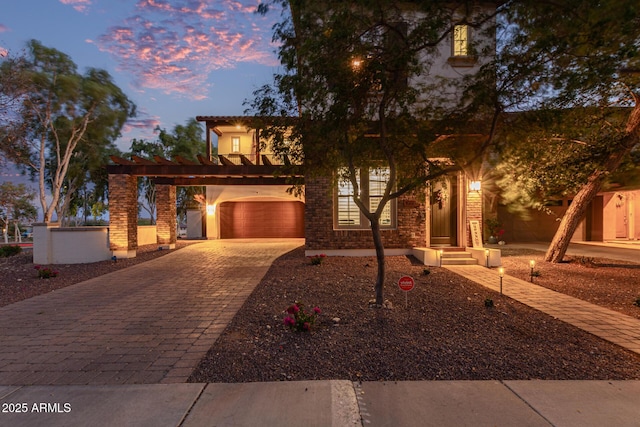 20689 W Valley View Dr, Buckeye, AZ 85396 - view of front of home with decorative driveway, stucco siding, and a garage