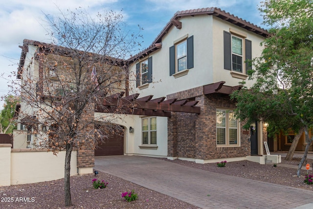 20689 W Valley View Dr, Buckeye, AZ 85396 - mediterranean / spanish-style home with driveway, stucco siding, an attached garage, and a tile roof
