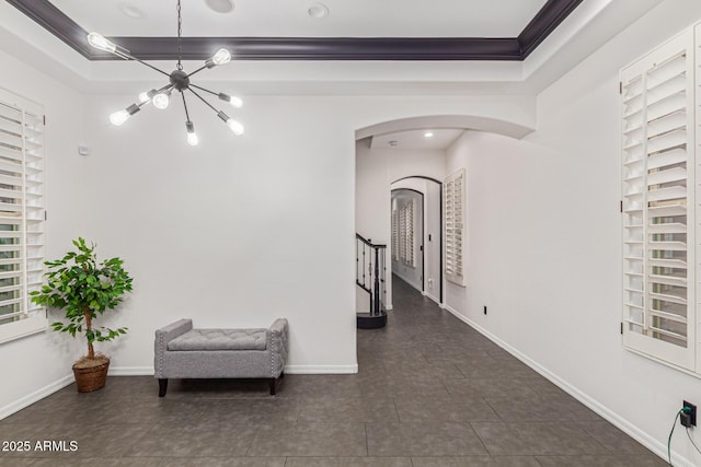 20689 W Valley View Dr, Buckeye, AZ 85396 - hallway with arched walkways, a chandelier, crown molding, stairway, and a tray ceiling