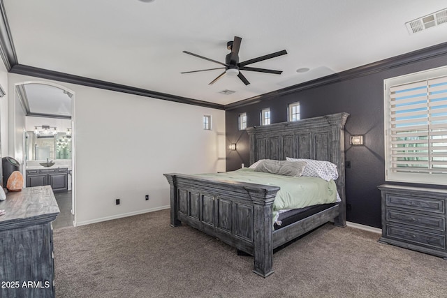 20689 W Valley View Dr, Buckeye, AZ 85396 - bedroom featuring ornamental molding, carpet flooring, baseboards, ceiling fan, and connected bathroom
