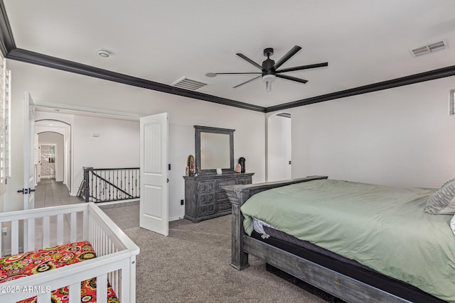 20689 W Valley View Dr, Buckeye, AZ 85396 - carpeted bedroom with crown molding, arched walkways, baseboards, and a ceiling fan