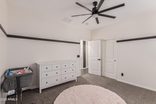 20689 W Valley View Dr, Buckeye, AZ 85396 - bedroom featuring dark colored carpet, baseboards, and a ceiling fan