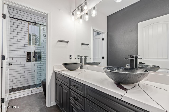 20689 W Valley View Dr, Buckeye, AZ 85396 - full bath featuring double vanity, a shower stall, tile patterned floors, and toilet