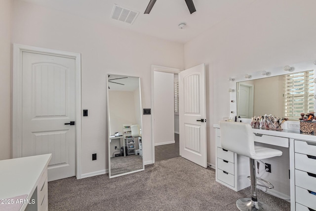 20689 W Valley View Dr, Buckeye, AZ 85396 - office featuring a ceiling fan, dark colored carpet, and baseboards