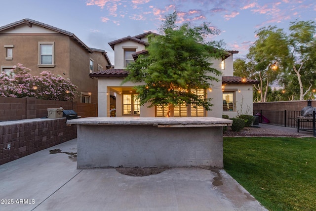20689 W Valley View Dr, Buckeye, AZ 85396 - rear view of house with a tiled roof, a patio area, and stucco siding