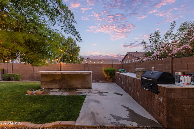 20689 W Valley View Dr, Buckeye, AZ 85396 - yard at dusk with area for grilling and a patio area