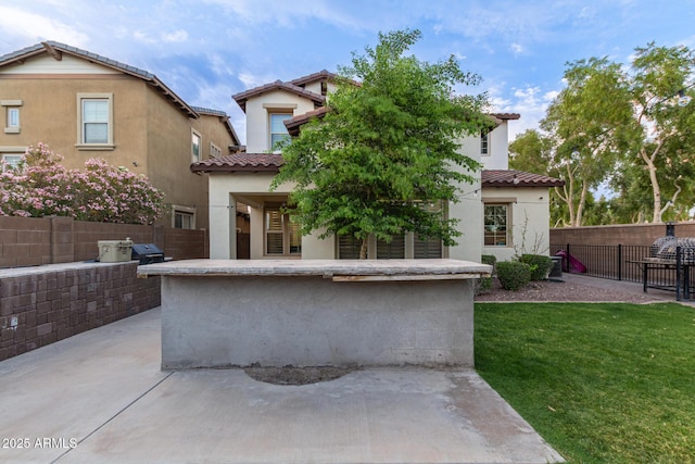 20689 W Valley View Dr, Buckeye, AZ 85396 - rear view of property with stucco siding, a tiled roof, a patio area, and an outdoor kitchen