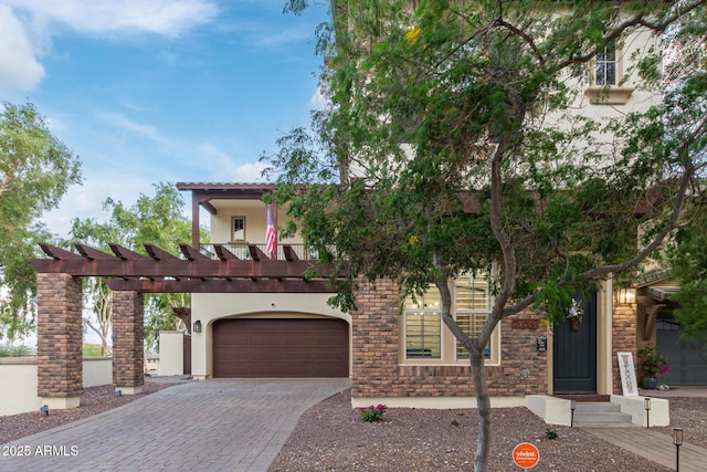 20689 W Valley View Dr, Buckeye, AZ 85396 - view of front of home featuring decorative driveway, stucco siding, and a garage