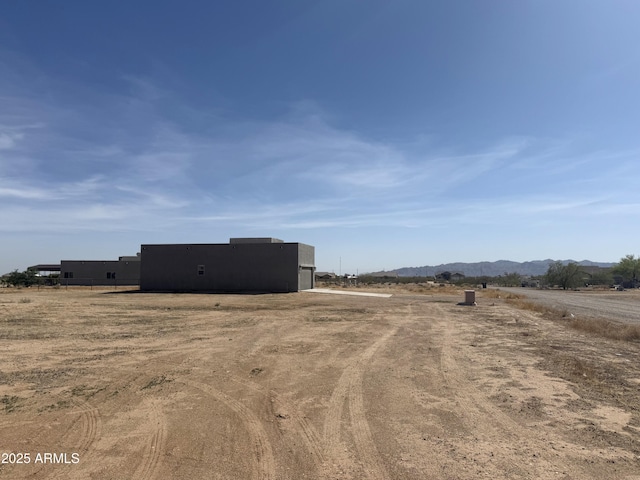 32515 N 214th Ave, Wittmann, AZ 85361 - exterior space with an outdoor structure, a rural view, an outbuilding, and a mountain view