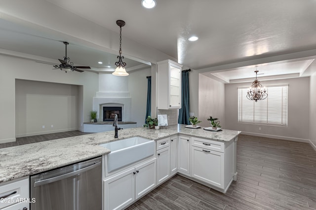 6397 E Red Oak Cir, Hereford, AZ 85615 - kitchen featuring baseboards, white cabinets, a sink, ceiling fan with notable chandelier, and dishwasher