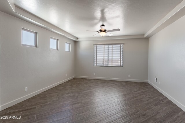 6397 E Red Oak Cir, Hereford, AZ 85615 - unfurnished room with baseboards, dark wood-style flooring, and ceiling fan