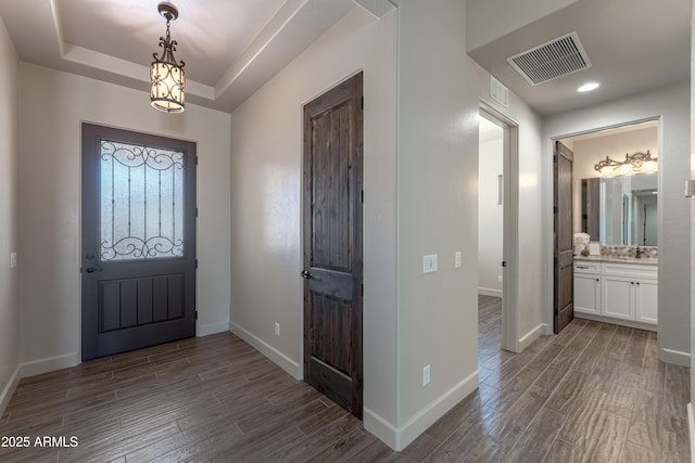 6397 E Red Oak Cir, Hereford, AZ 85615 - foyer with baseboards, visible vents, and dark wood-style floors