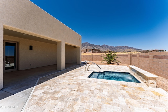 6397 E Red Oak Cir, Hereford, AZ 85615 - view of pool featuring a fenced backyard, a mountain view, a jacuzzi, and a patio