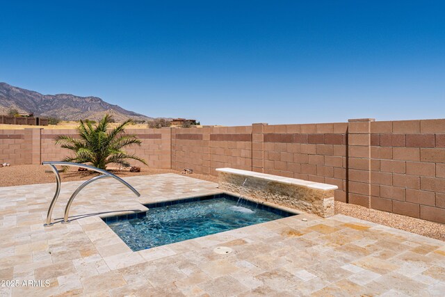 6397 E Red Oak Cir, Hereford, AZ 85615 - view of pool featuring an in ground hot tub, a mountain view, a fenced backyard, and a patio area