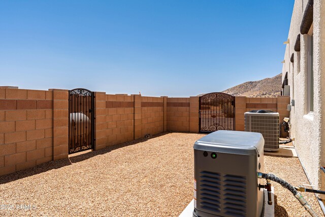 6397 E Red Oak Cir, Hereford, AZ 85615 - view of yard featuring fence private yard, a gate, and central AC