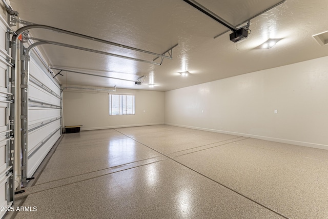 6397 E Red Oak Cir, Hereford, AZ 85615 - garage with baseboards and a garage door opener