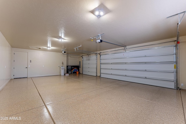 6397 E Red Oak Cir, Hereford, AZ 85615 - garage with baseboards and a garage door opener
