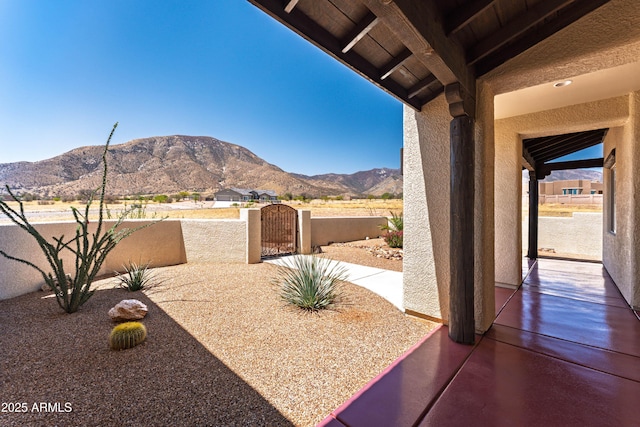 6397 E Red Oak Cir, Hereford, AZ 85615 - view of patio with fence, a gate, and a mountain view
