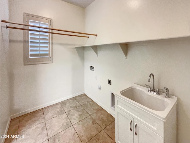 clothes washing area featuring cabinets, sink, washer hookup, hookup for an electric dryer, and light tile patterned flooring