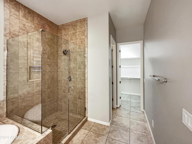 bathroom with tile patterned flooring and independent shower and bath