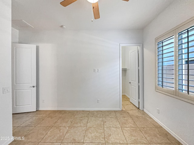 10559 E Simone Ave, Mesa, AZ 85212 - empty room with a ceiling fan and light tile patterned floors