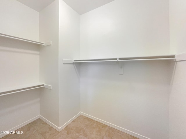 10559 E Simone Ave, Mesa, AZ 85212 - walk in closet featuring light tile patterned floors