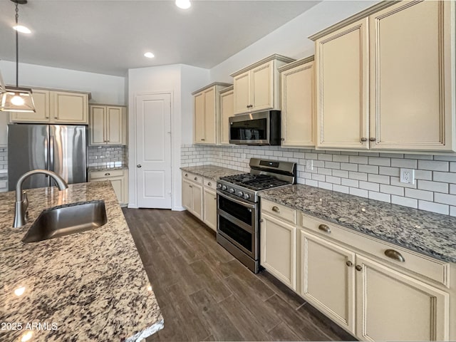 10559 E Simone Ave, Mesa, AZ 85212 - kitchen with cream cabinets, appliances with stainless steel finishes, dark wood-style floors, and recessed lighting