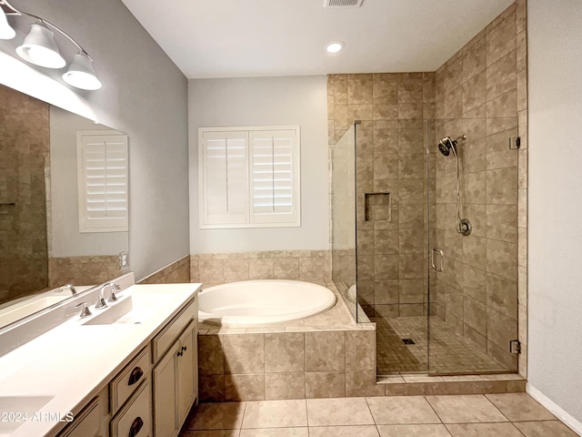 bathroom with vanity, tile patterned floors, and independent shower and bath