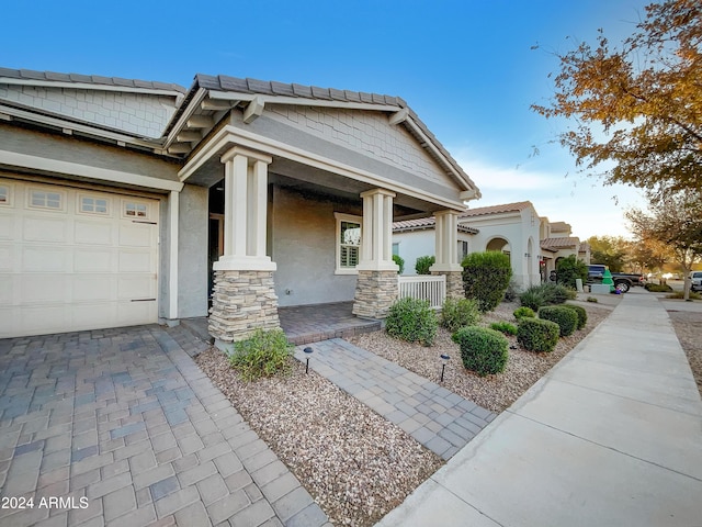 view of front of property featuring covered porch