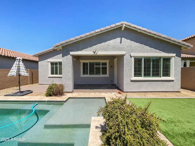 10559 E Simone Ave, Mesa, AZ 85212 - rear view of house featuring a patio area, a fenced backyard, an outdoor pool, and stucco siding