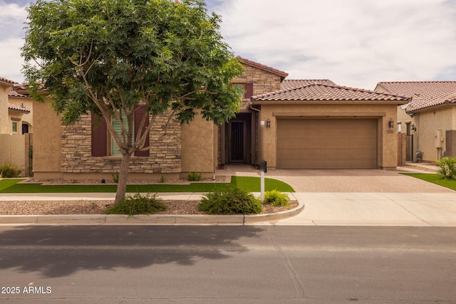 5250 S Wesley Cir, Mesa, AZ 85212 - mediterranean / spanish-style home featuring a garage, stucco siding, driveway, a tiled roof, and stone siding