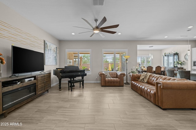 5250 S Wesley Cir, Mesa, AZ 85212 - living room featuring a ceiling fan, plenty of natural light, recessed lighting, and baseboards