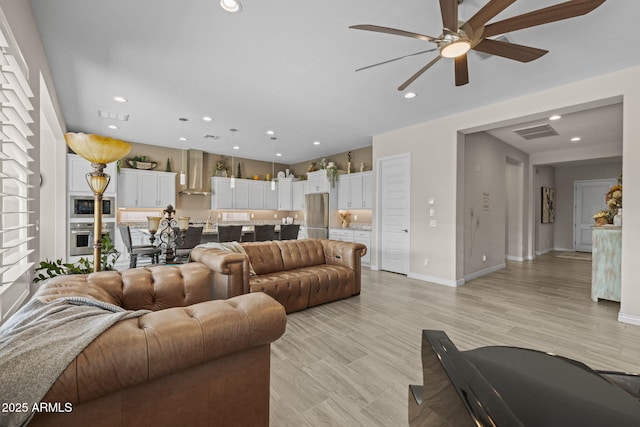 5250 S Wesley Cir, Mesa, AZ 85212 - living room with ceiling fan, recessed lighting, baseboards, and light wood-type flooring