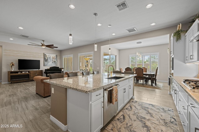 5250 S Wesley Cir, Mesa, AZ 85212 - kitchen with a sink, an island with sink, stainless steel appliances, white cabinets, and recessed lighting