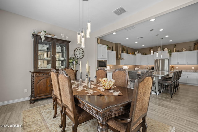 5250 S Wesley Cir, Mesa, AZ 85212 - dining space with light wood-style floors, recessed lighting, baseboards, and a chandelier