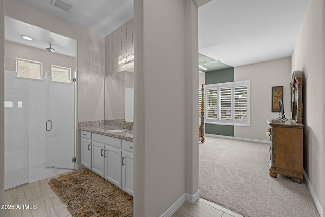 5250 S Wesley Cir, Mesa, AZ 85212 - bathroom featuring vanity, a shower stall, healthy amount of natural light, and baseboards