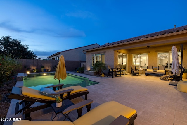 5250 S Wesley Cir, Mesa, AZ 85212 - pool at dusk with an outdoor hangout area, a fenced backyard, ceiling fan, and a patio