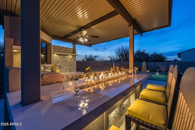 5250 S Wesley Cir, Mesa, AZ 85212 - patio terrace at dusk with ceiling fan and a fenced backyard