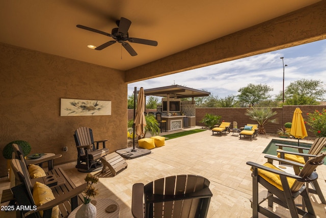 5250 S Wesley Cir, Mesa, AZ 85212 - fenced backyard featuring a ceiling fan, a patio area, exterior kitchen, and a bar