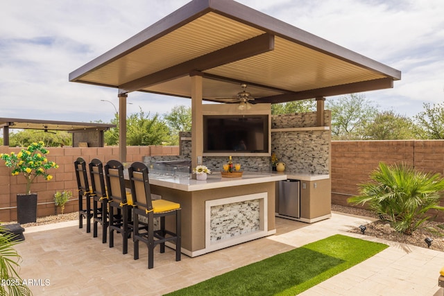 5250 S Wesley Cir, Mesa, AZ 85212 - fenced backyard featuring exterior bar, area for grilling, a patio area, and ceiling fan