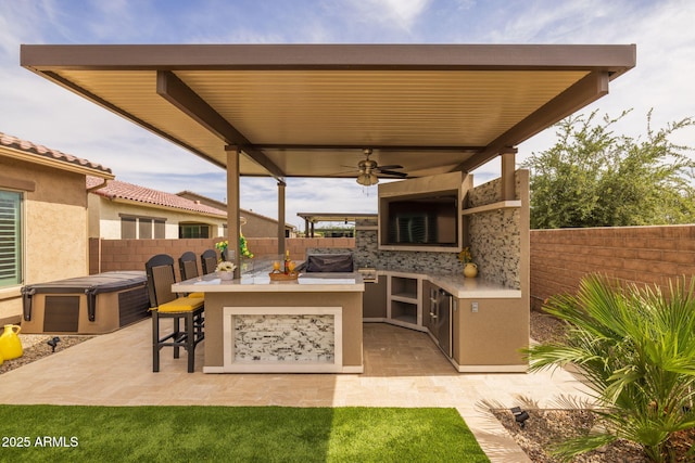 5250 S Wesley Cir, Mesa, AZ 85212 - fenced backyard featuring area for grilling, a hot tub, a patio area, and ceiling fan