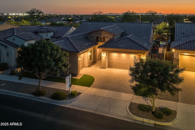 5250 S Wesley Cir, Mesa, AZ 85212 - view of front of property featuring a tiled roof, stucco siding, driveway, an attached garage, and a residential view