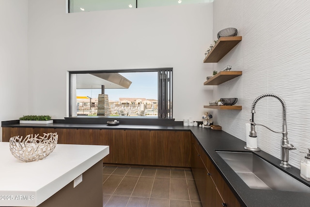 5250 S Wesley Cir, Mesa, AZ 85212 - kitchen with open shelves, tile patterned floors, a sink, dark countertops, and modern cabinets