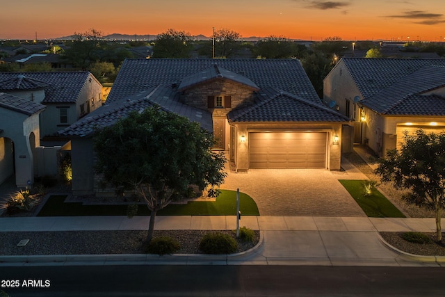 5250 S Wesley Cir, Mesa, AZ 85212 - view of front of house with a tile roof, a garage, driveway, stucco siding, and a residential view