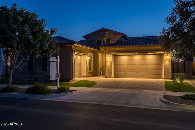 5250 S Wesley Cir, Mesa, AZ 85212 - view of front facade featuring a tile roof, driveway, an attached garage, and stucco siding